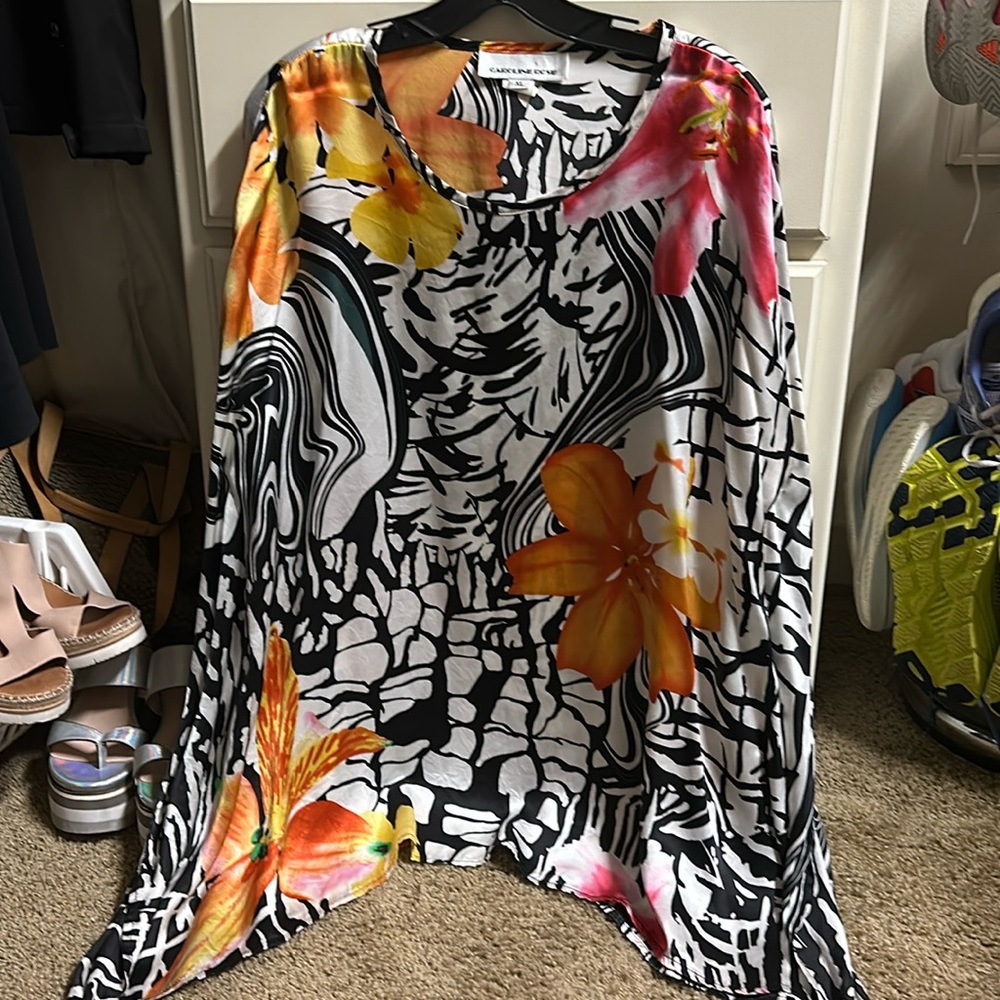 Absolutely stunning silky tunic. Vibrant colors and flowing fabric. Multi color